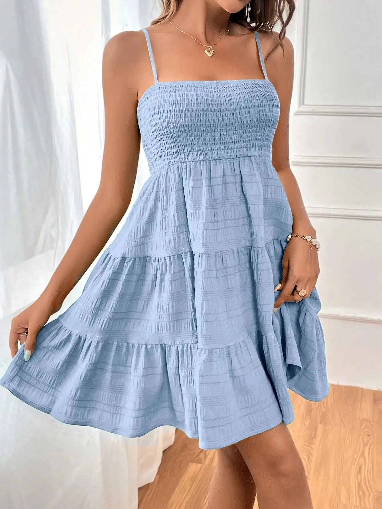 Ruba Tiered A-Line Mini Dress
فستان رُبى الميني المتدرّج